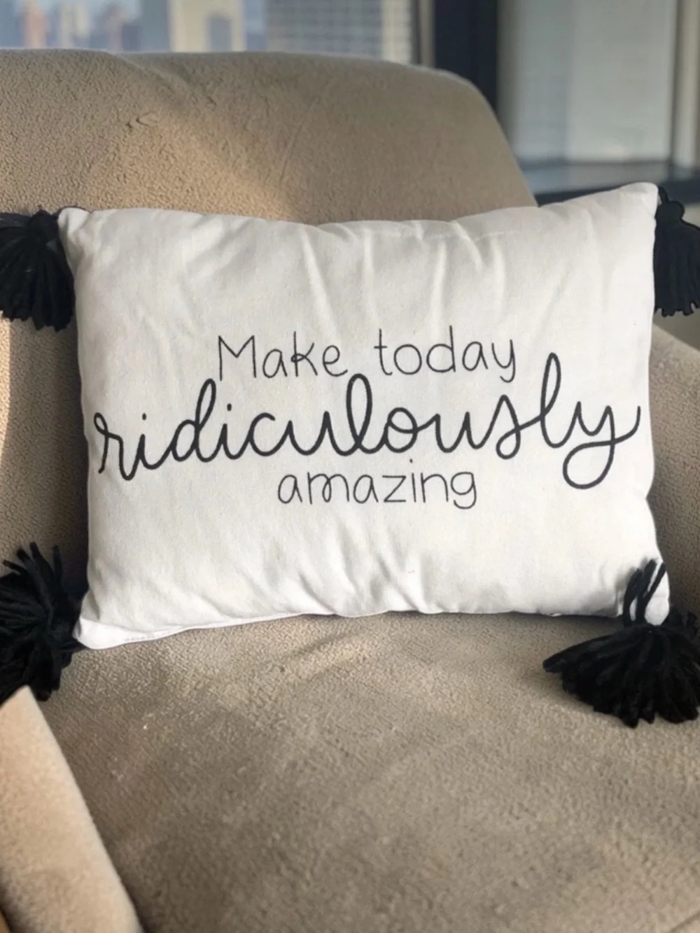 White Decorative Pillow with Black Script and Tassels